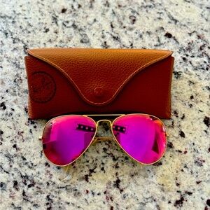 Ray Ban Sunglasses. Gold frames. Pink lenses.